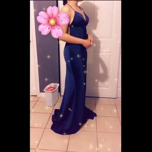 It’s a solid color navy blue prom dress.